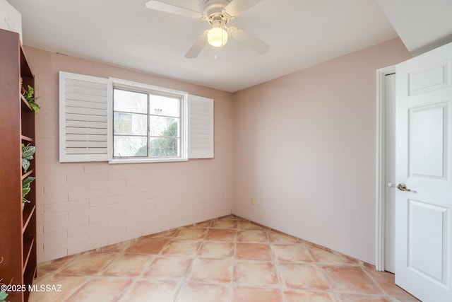 spare room featuring ceiling fan