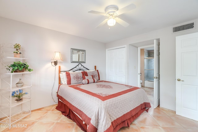 bedroom with ceiling fan, visible vents, light tile patterned floors, and a closet