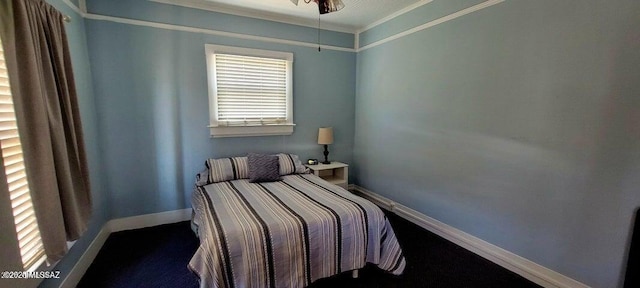 bedroom with baseboards and ornamental molding