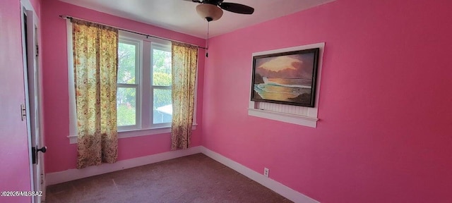 carpeted empty room with baseboards and ceiling fan