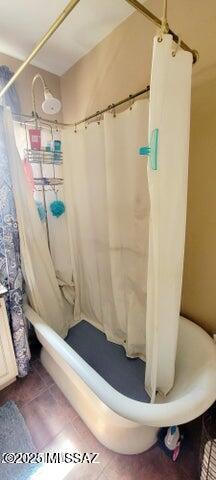 full bathroom featuring a shower stall and tile patterned floors