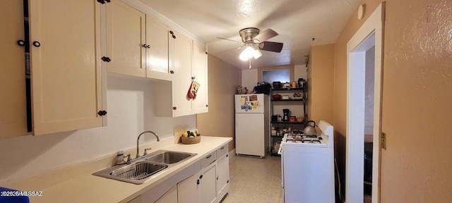 kitchen featuring white cabinets, a sink, ceiling fan, and white appliances