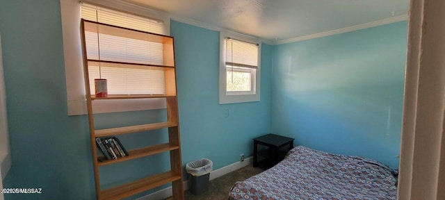 carpeted bedroom featuring baseboards and ornamental molding