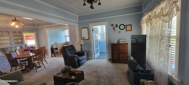 carpeted living area featuring crown molding