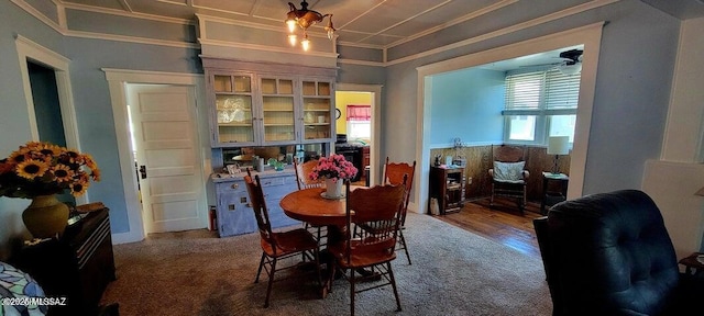 dining room featuring ornamental molding and a ceiling fan