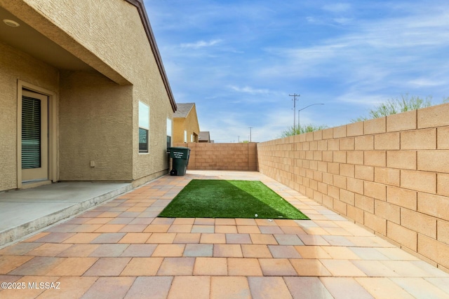 view of patio featuring a fenced backyard