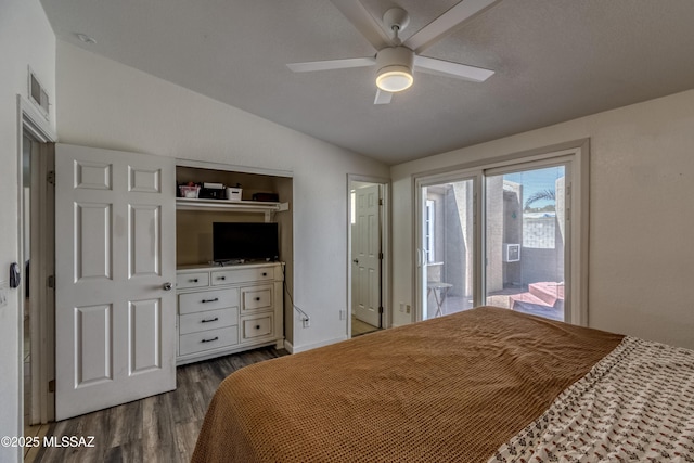 bedroom with lofted ceiling, dark wood-style flooring, access to exterior, visible vents, and a ceiling fan