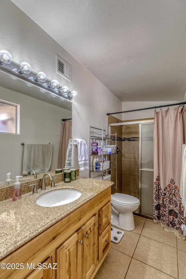 full bathroom with tile patterned floors, toilet, vanity, curtained shower, and visible vents