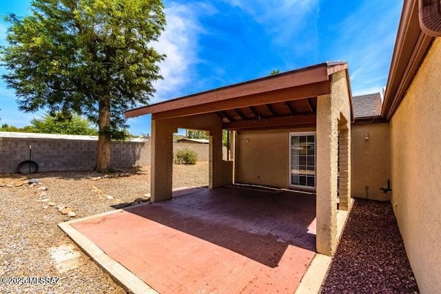 view of patio / terrace featuring fence