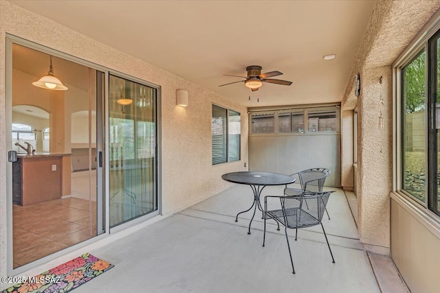660 W Via Rosaldo, Green Valley, AZ 85614 - sunroom with a ceiling fan and arched walkways