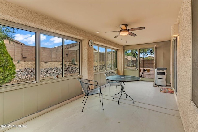 660 W Via Rosaldo, Green Valley, AZ 85614 - unfurnished sunroom featuring ceiling fan and heating unit