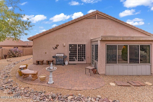 660 W Via Rosaldo, Green Valley, AZ 85614 - rear view of property with fence, a patio, and stucco siding