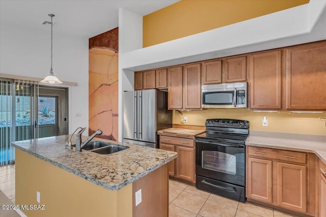 660 W Via Rosaldo, Green Valley, AZ 85614 - kitchen featuring light stone countertops, a center island with sink, stainless steel appliances, pendant lighting, and a sink