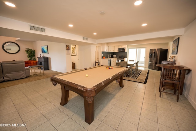rec room with light tile patterned floors, recessed lighting, and visible vents