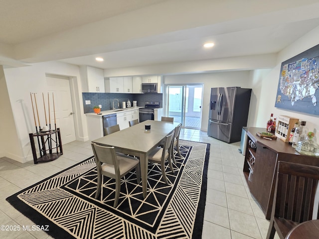 dining room with light tile patterned flooring and recessed lighting