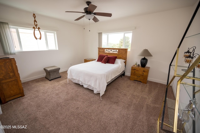 bedroom with baseboards, carpet flooring, and multiple windows
