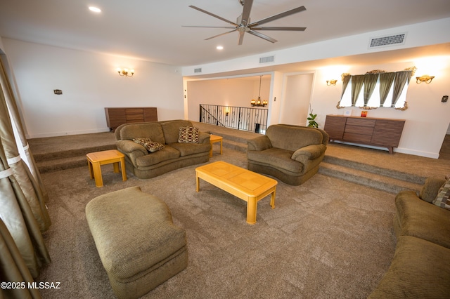 carpeted living area with visible vents, recessed lighting, and a ceiling fan