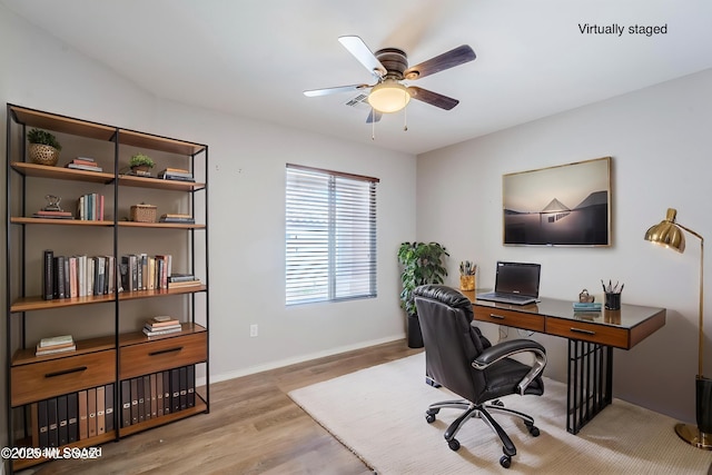office space with wood finished floors, baseboards, and ceiling fan