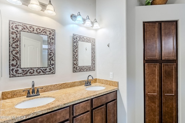 full bathroom featuring a sink and double vanity