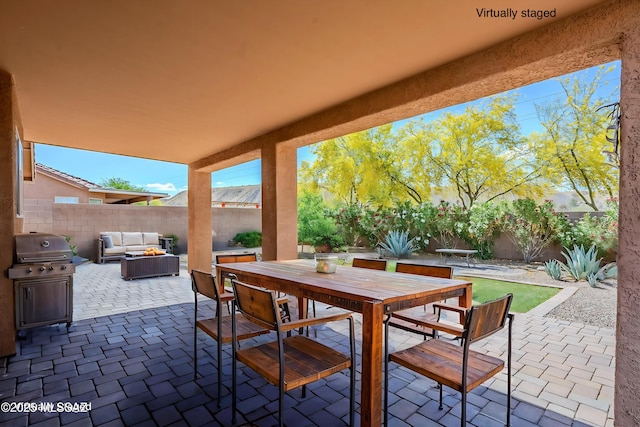 view of patio / terrace featuring outdoor lounge area, a fenced backyard, area for grilling, and outdoor dining area