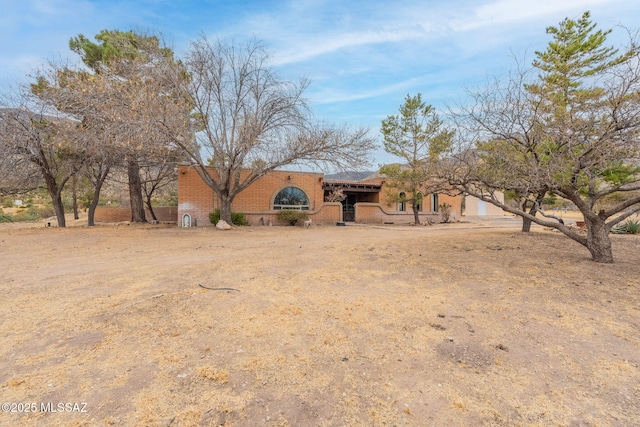 5374 E Spring Rd, Hereford, AZ 85615 - view of front of home featuring brick siding and an attached garage