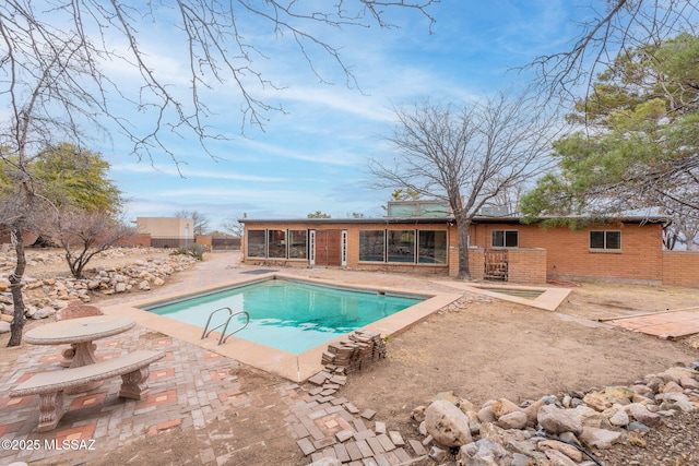 5374 E Spring Rd, Hereford, AZ 85615 - outdoor pool with a sunroom and a patio