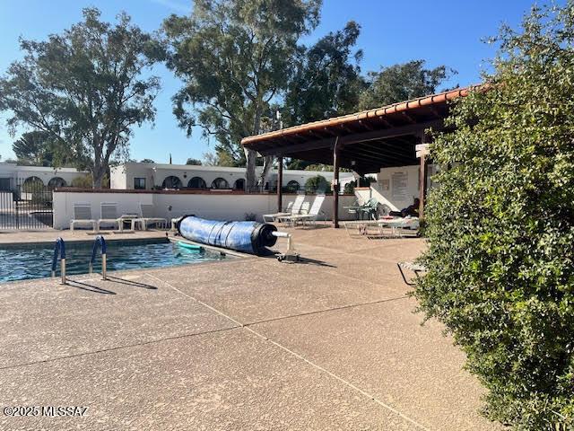 exterior space featuring a patio area and fence