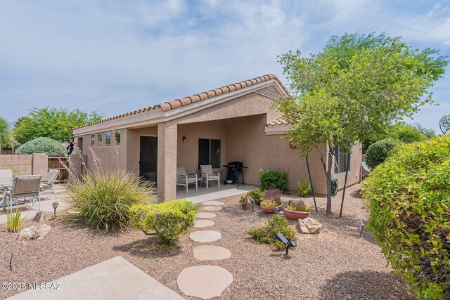 9566 E Creek Vista Pl, Tucson, AZ 85749 - rear view of house with a patio, stucco siding, and a tiled roof