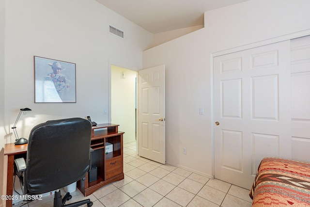 office area featuring light tile patterned flooring and visible vents
