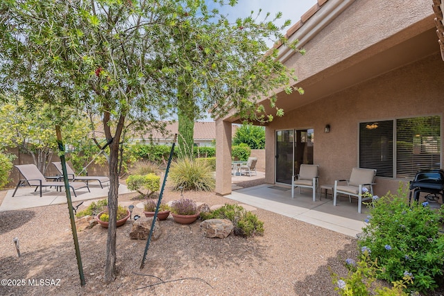 view of yard featuring a patio and fence