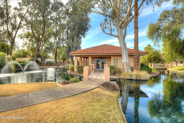 view of home's community with a water view