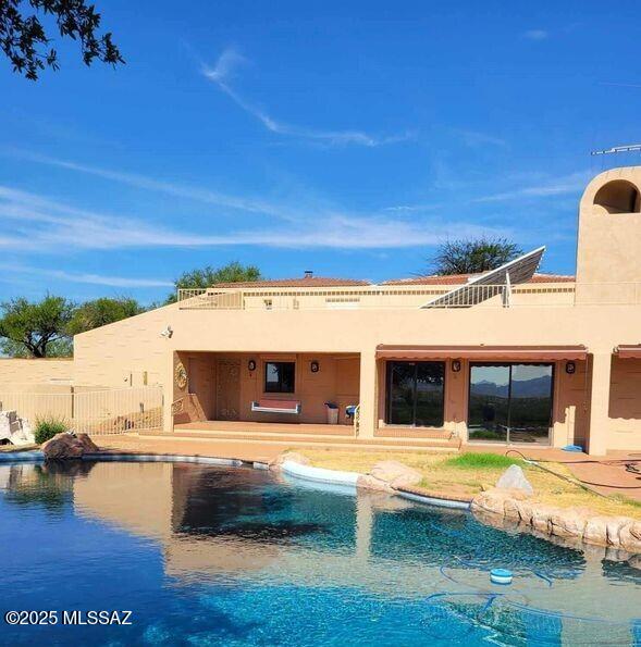 32551 S Moyza Ranch Rd, Amado, AZ 85645 - exterior space with a patio area, stucco siding, fence, and a fenced in pool