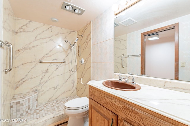 32551 S Moyza Ranch Rd, Amado, AZ 85645 - bathroom with toilet, vanity, and a marble finish shower