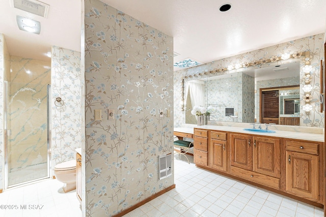 32551 S Moyza Ranch Rd, Amado, AZ 85645 - bathroom featuring wallpapered walls, toilet, and a marble finish shower