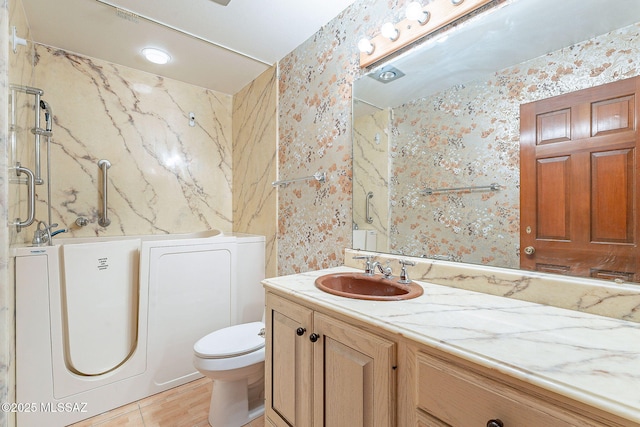 32551 S Moyza Ranch Rd, Amado, AZ 85645 - bathroom featuring wallpapered walls, toilet, vanity, and washer / clothes dryer