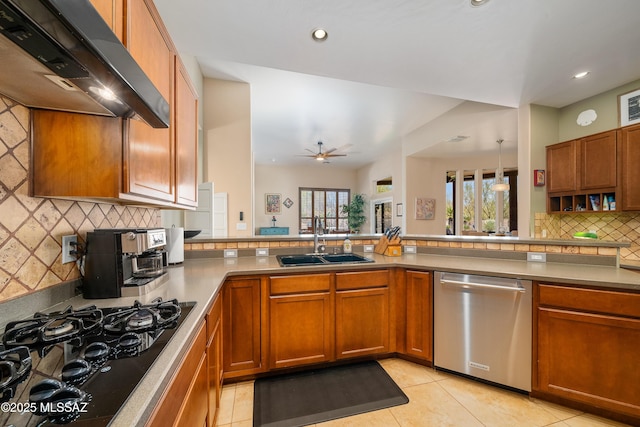 kitchen with black gas cooktop, under cabinet range hood, brown cabinets, dishwasher, and a sink