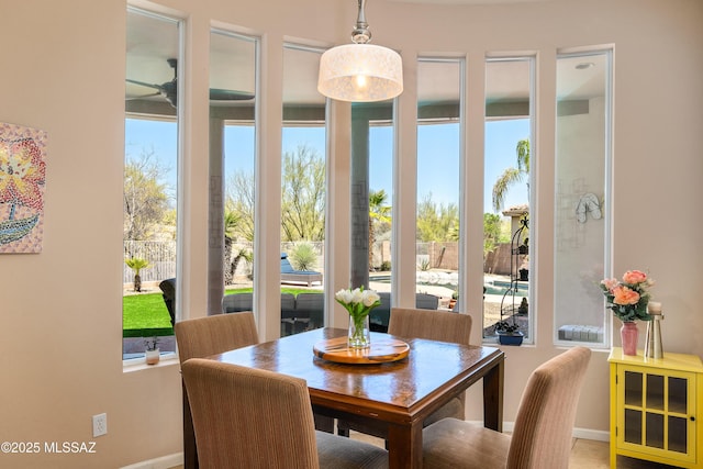 dining area featuring baseboards