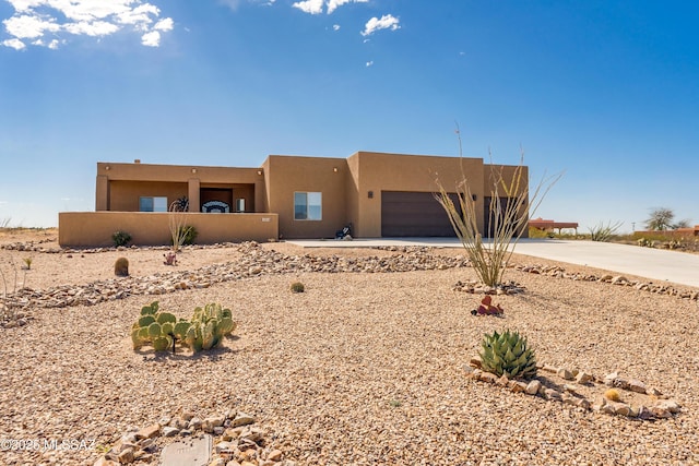 13416 S Sundown Ranch Rd, Vail, AZ 85641 - pueblo-style house featuring stucco siding, driveway, and a garage