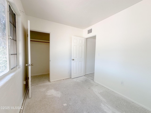 3926 E Camino De Palmas, Tucson, AZ 85711 - unfurnished bedroom featuring baseboards and a closet