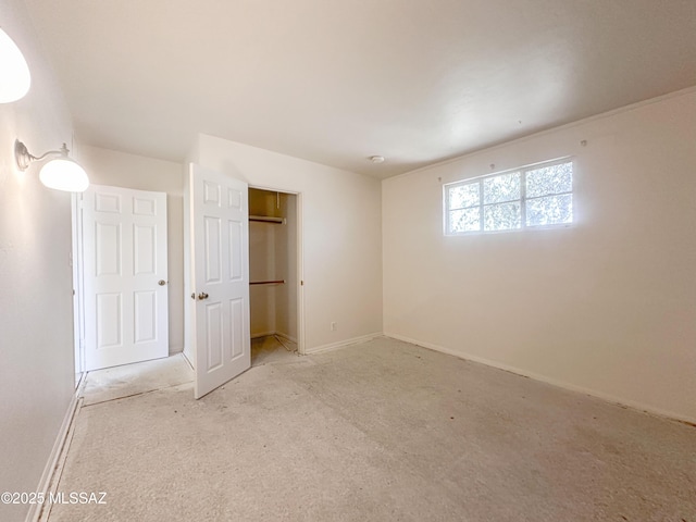3926 E Camino De Palmas, Tucson, AZ 85711 - unfurnished bedroom with carpet flooring, baseboards, and a closet