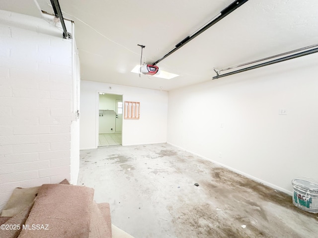 3926 E Camino De Palmas, Tucson, AZ 85711 - garage with a garage door opener and baseboards