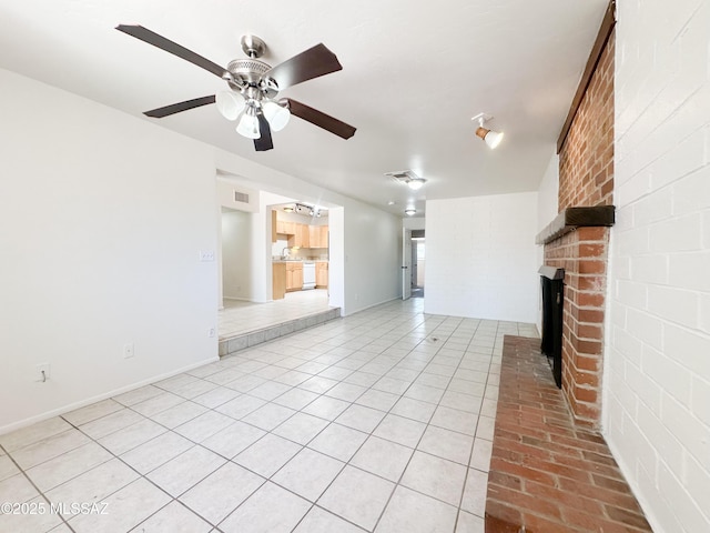 3926 E Camino De Palmas, Tucson, AZ 85711 - unfurnished living room with ceiling fan, a brick fireplace, and light tile patterned floors