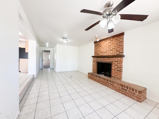 3926 E Camino De Palmas, Tucson, AZ 85711 - unfurnished living room featuring ceiling fan, a fireplace, and light tile patterned floors