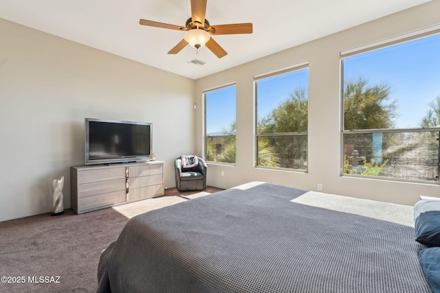bedroom featuring carpet floors, ceiling fan, and visible vents