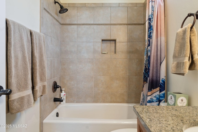 bathroom with shower / tub combo, toilet, and vanity