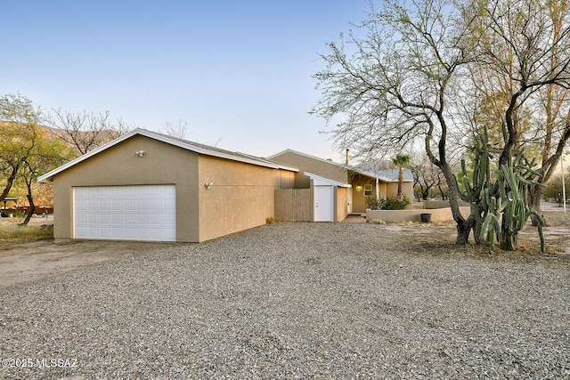 15690 N Roadrunner Ridge Ln, Tucson, AZ 85739 - view of side of property featuring driveway and stucco siding