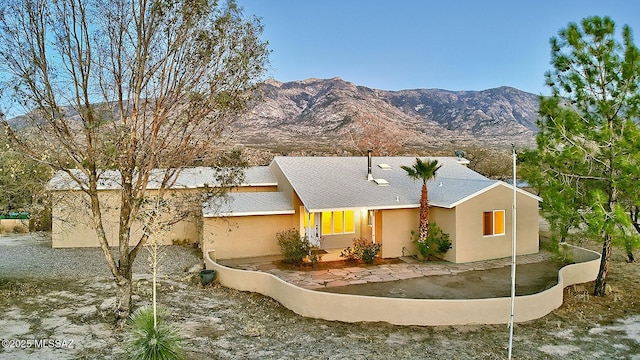 15690 N Roadrunner Ridge Ln, Tucson, AZ 85739 - single story home with stucco siding, a mountain view, and a shingled roof