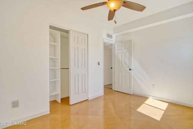 unfurnished bedroom featuring a ceiling fan, tile patterned floors, a closet, baseboards, and visible vents