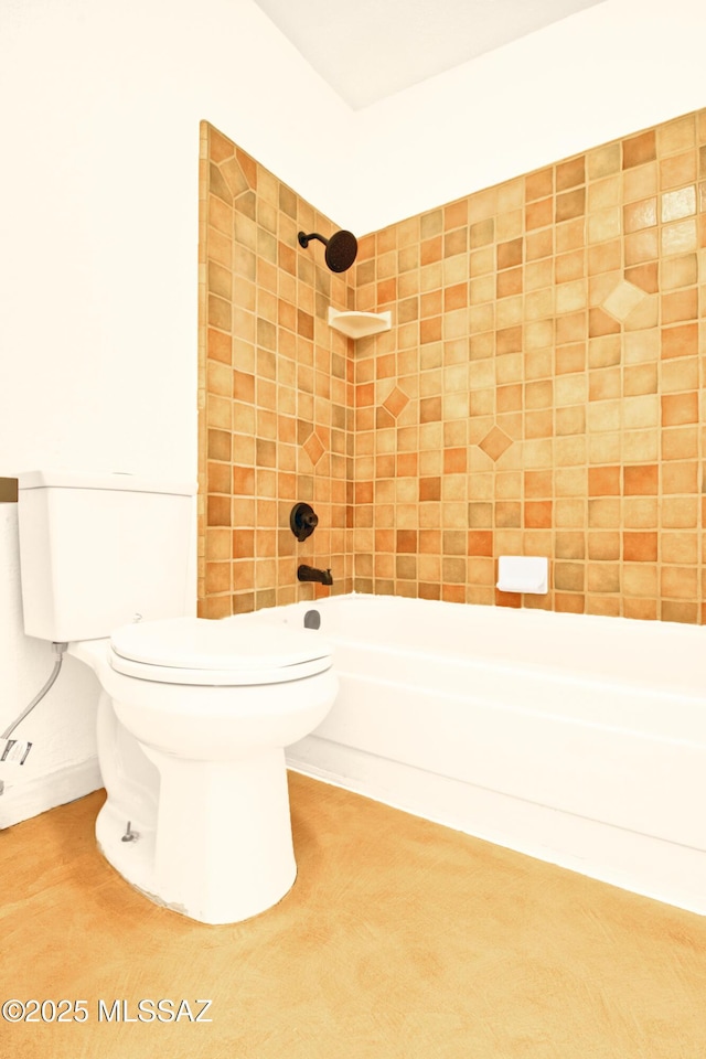 bathroom featuring toilet and bathtub / shower combination