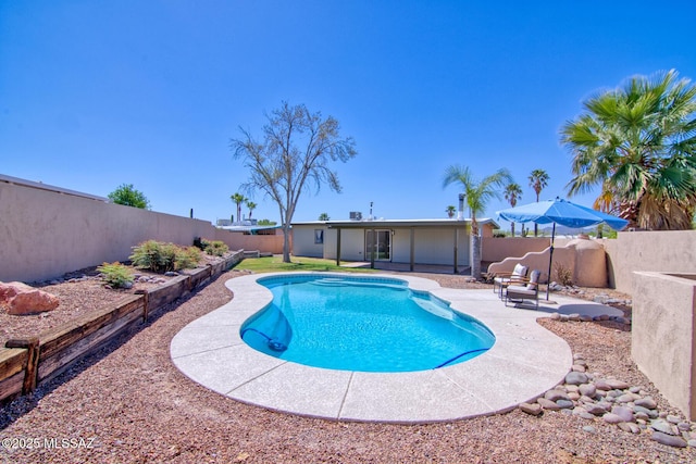 view of swimming pool featuring a patio area, a fenced in pool, and a fenced backyard